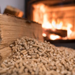 Wood stove heating with in foreground wood pellets - economical heating system concept
